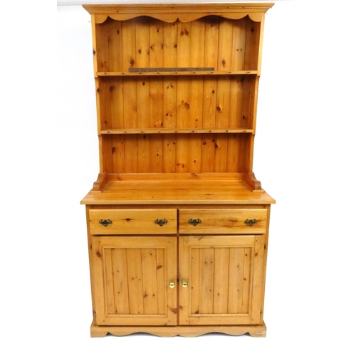 68 - Pine dresser fitted with an open plate rack above two drawers and a pair of cupboard drawers, 200cm ... 