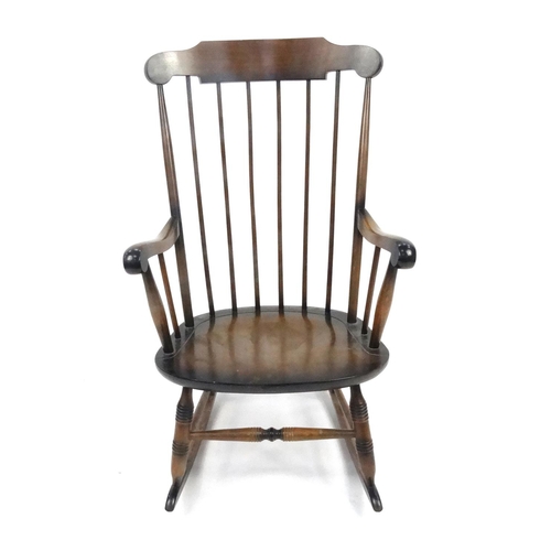 124 - Stained wooden stick back rocking chair