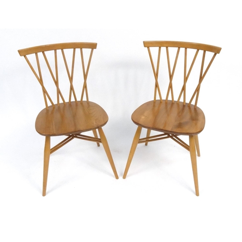 127 - Pair of Ercol light elm stick back chairs