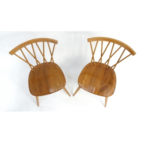 127 - Pair of Ercol light elm stick back chairs