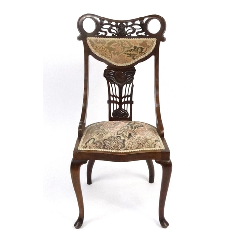 112 - Art Nouveau influence carved mahogany occasional chair, the back 96cm high