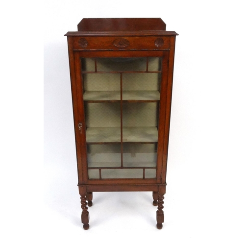 79 - Carved oak china cabinet raised on Barley twist legs, 140cm x 58cm wide x 30cm deep