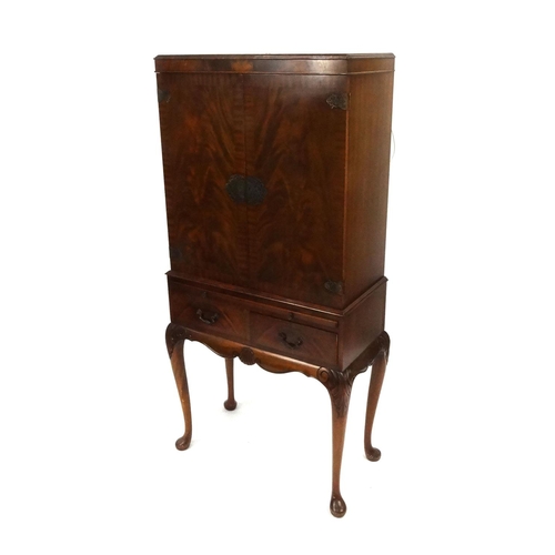 22 - Carved mahogany two door side cabinet with carved decoration raised on cabriole legs, 160cm high x 8... 