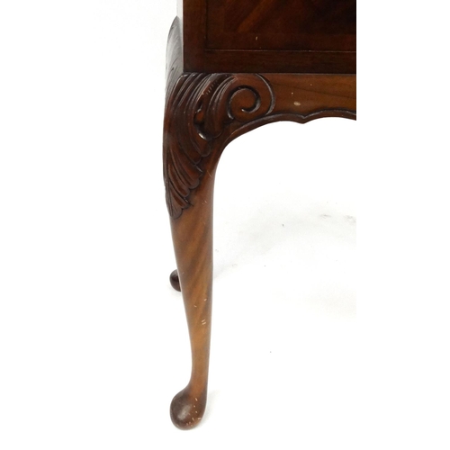 22 - Carved mahogany two door side cabinet with carved decoration raised on cabriole legs, 160cm high x 8... 