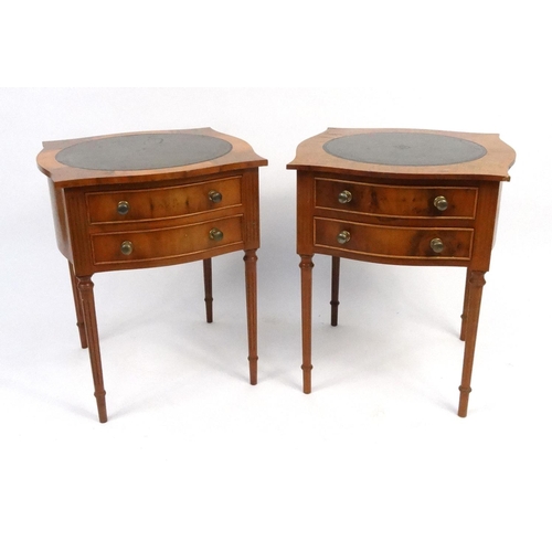 63 - Pair of yew wood two drawer night stands with tooled leather tops, 64cm high x 54cm sqaure