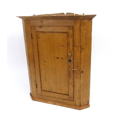 113 - Pine wall hanging corner cupboard, 85cm high x 80cm wide x 53cm deep