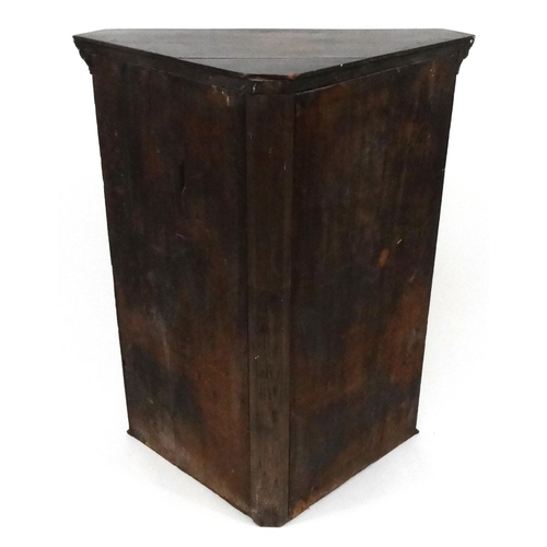 116 - Carved oak hanging corner cabinet with glazed door, 93cm high x 75cm wide x 38cm deep