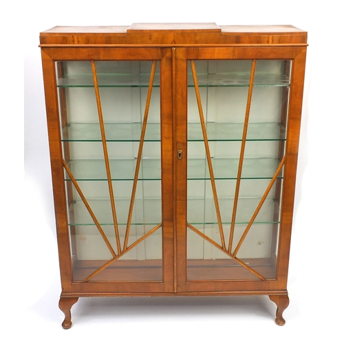 2050 - Art Deco walnut china cabinet fitted with a pair of glazed sunburst design doors enclosing four glas... 