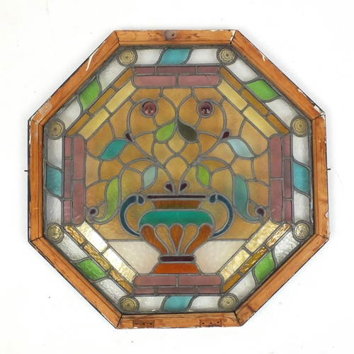 37 - Octagonal colourful leaded stained glass window panel, decorated with flowers in a vase, mounted in ... 