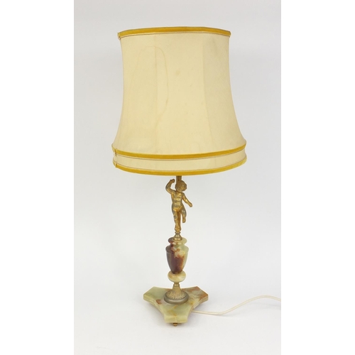 58 - Onyx and gilt metal table lamp with cherub support and silk lined shade, 76cm high