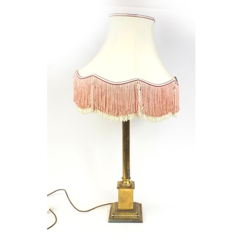 153 - Brass reeded column table lamp with silk lined tasselled shade, 96cm high