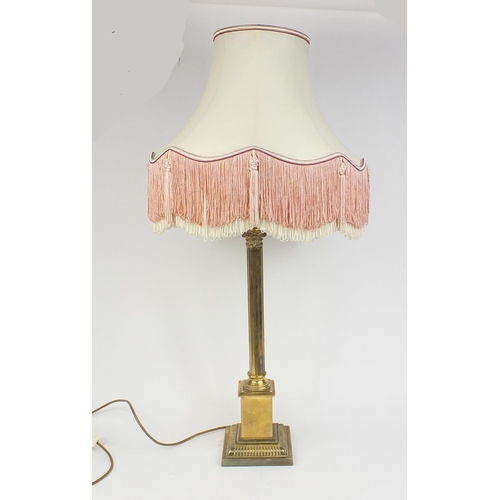 153 - Brass reeded column table lamp with silk lined tasselled shade, 96cm high