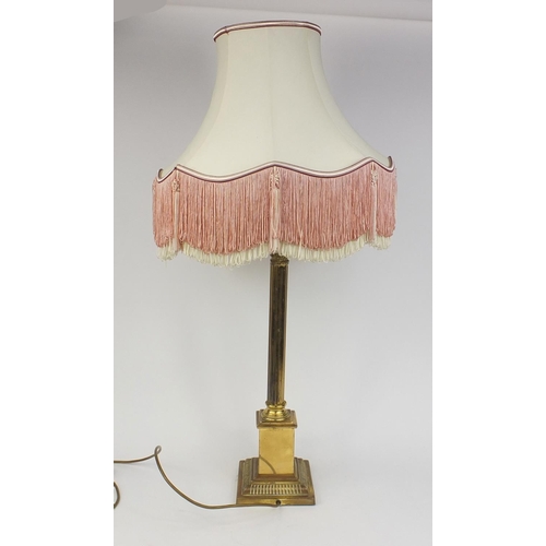 153 - Brass reeded column table lamp with silk lined tasselled shade, 96cm high