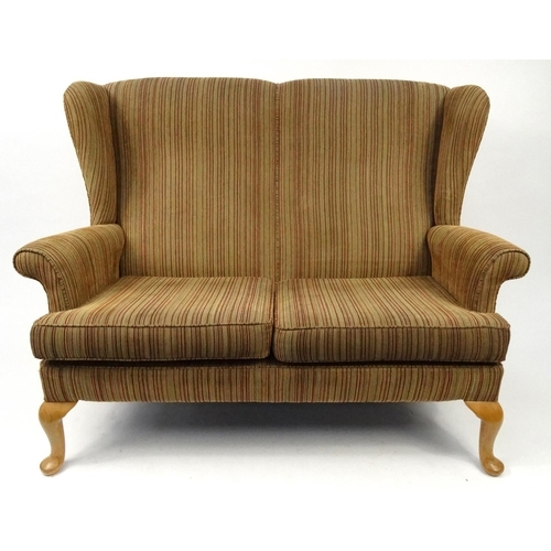 126A - Three piece wing back suite comprising two seater setee and two arm chairs with wooden cabriole free... 