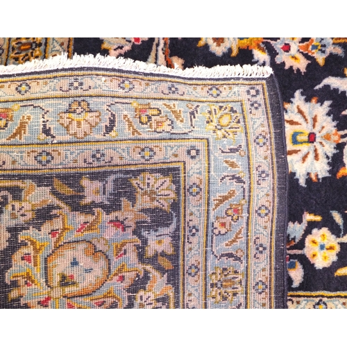 2013 - Large rectangular Persian Kashan rug, the central field and boarders with a stylised floral design o... 