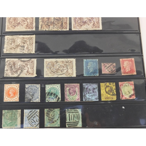 243 - Sheet of Victorian and later stamps mounted on a card including seahorses and a penny red