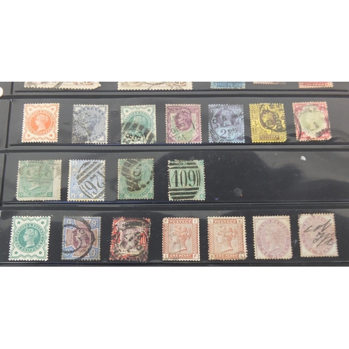 243 - Sheet of Victorian and later stamps mounted on a card including seahorses and a penny red