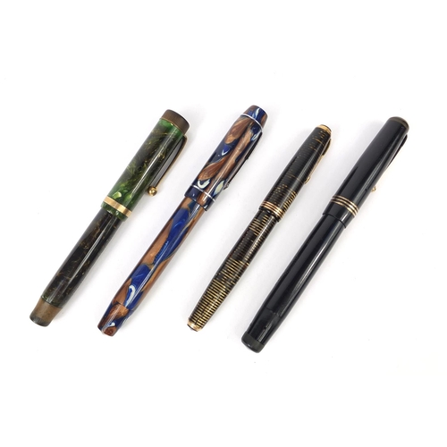 81 - Group of four fountain pens comprising a Parker green marbleised duofold, Parker Banded vacumatic, b... 