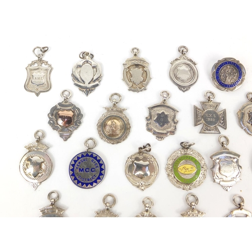 166 - Collection of twenty seven silver motorcycling jewels, some 1930's examples, mostly awarded to E Ken... 