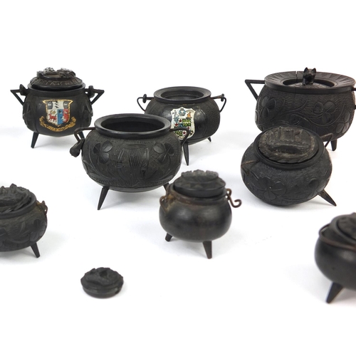 5 - Collection of Irish Bog oak inkwells and pots in the form of cauldrons, some with lids and ceramic l... 
