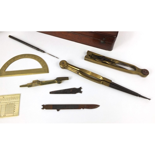 144 - 19th century mahogany cased drawing instrument set containing brass protractors and an ivory ruler, ... 