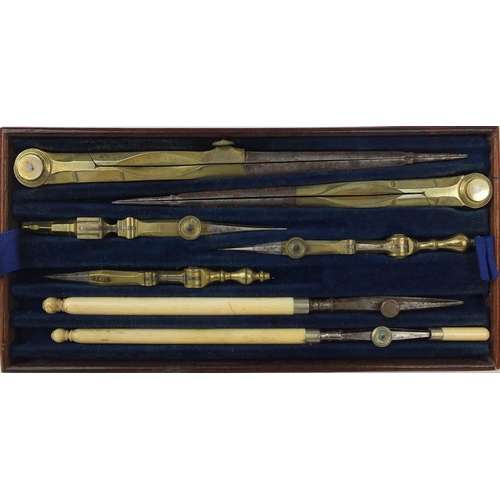 144 - 19th century mahogany cased drawing instrument set containing brass protractors and an ivory ruler, ... 