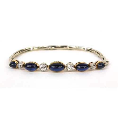 738 - Unmarked white metal cabochon sapphire and diamond expandable bracelet, set with five graduated sapp... 