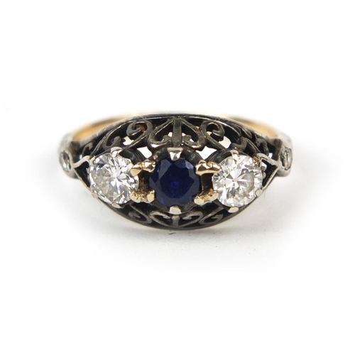 746 - Unmarked gold sapphire and diamond ring, set with two diamonds either side of a central saphire and ... 