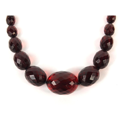 835 - Cherry amber coloured faceted bead necklace, 56cm long, approximate weight  35.4g