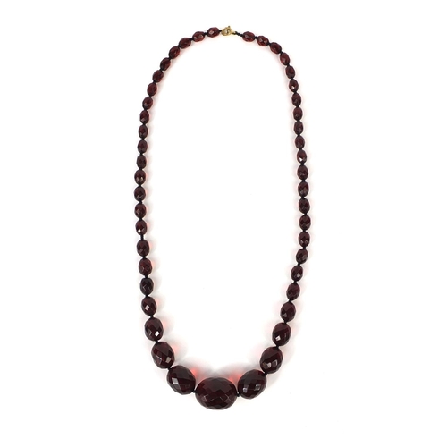 835 - Cherry amber coloured faceted bead necklace, 56cm long, approximate weight  35.4g