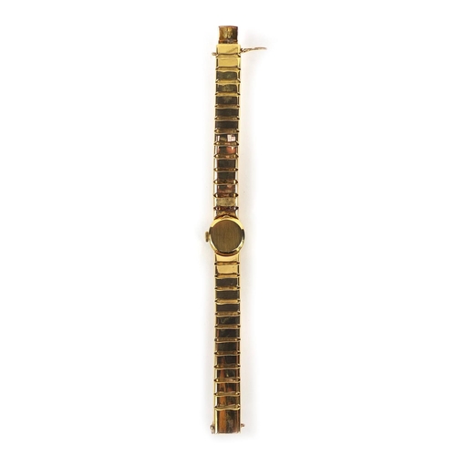 857 - Boxed ladies 18ct gold Omega wristwatch with 18ct gold strap, the movement no.14091129, approximate ... 