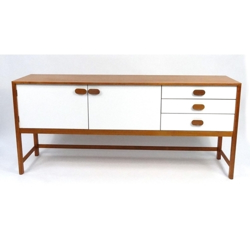 4 - Retro teak and white sideboard fitted with a pair of cupboard doors and three drawers, 81cm high x 1... 
