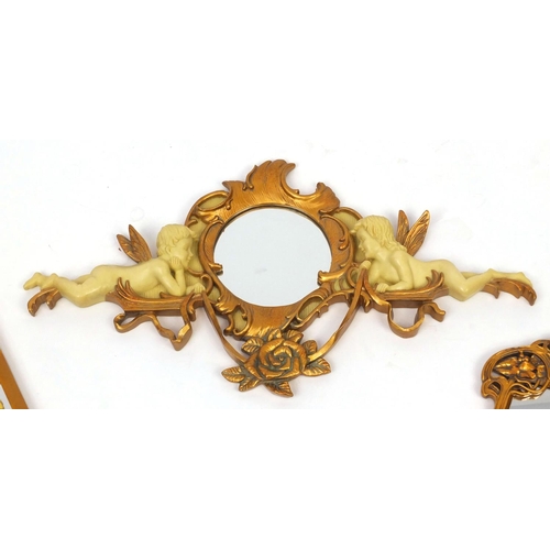 2076 - Group of four Art Nouveau style gilt and ivorine mirrors including three decorated with maidens, the... 