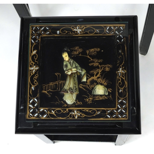 2032 - Nest of four Oriental lacquered occasional tables, each inlaid and hand painted with figures, the la... 