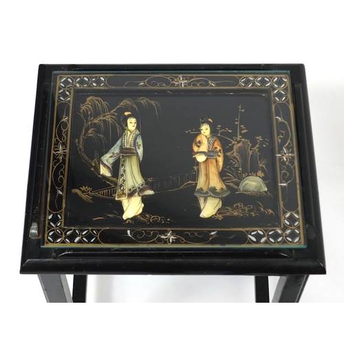 2032 - Nest of four Oriental lacquered occasional tables, each inlaid and hand painted with figures, the la... 