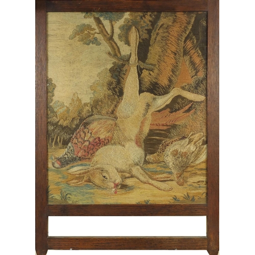50 - 19th century Wool work picture, pheasant and hare, framed, mounted in an oak frame, 56cm x 47cm excl... 