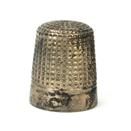 73 - Three thimbles comprising a gold coloured metal example set with six pearls housed in a Victorian ve... 