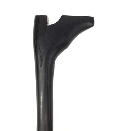 35 - Ebonised walking stick with carved handle in the form of a shoe, 87cm long