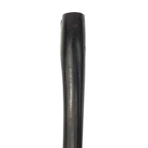 35 - Ebonised walking stick with carved handle in the form of a shoe, 87cm long