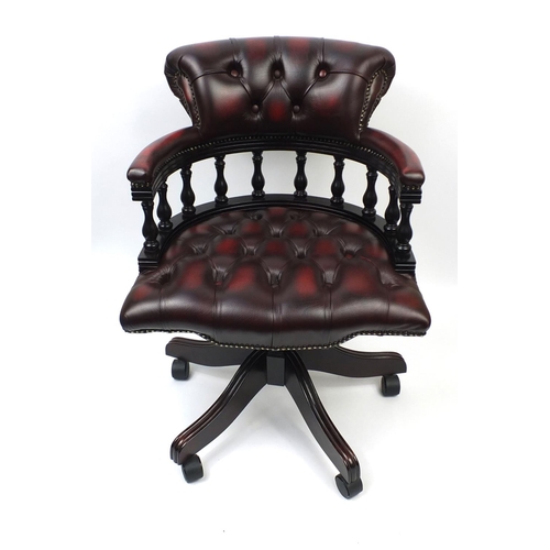 2003 - Ox blood leather captains chair with button back upholstery, 88cm high