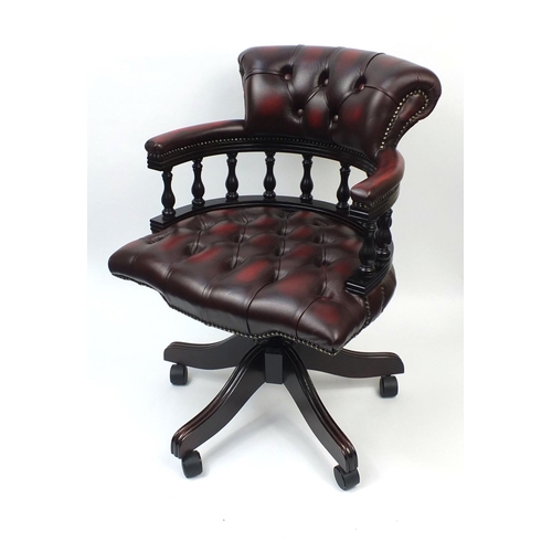 2003 - Ox blood leather captains chair with button back upholstery, 88cm high