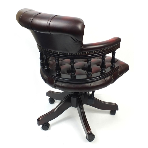 2003 - Ox blood leather captains chair with button back upholstery, 88cm high