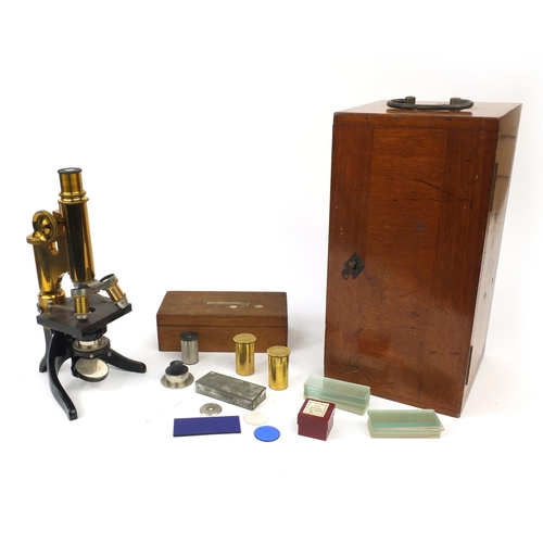 151 - E Leitz Wetzlar microscope together with fitted mahogany carrying case, lenses and an oak case of gl... 