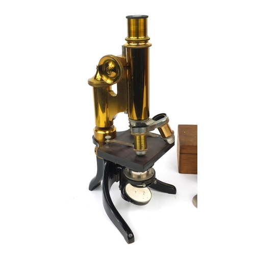 151 - E Leitz Wetzlar microscope together with fitted mahogany carrying case, lenses and an oak case of gl... 