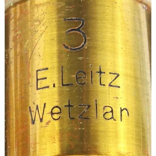 151 - E Leitz Wetzlar microscope together with fitted mahogany carrying case, lenses and an oak case of gl... 