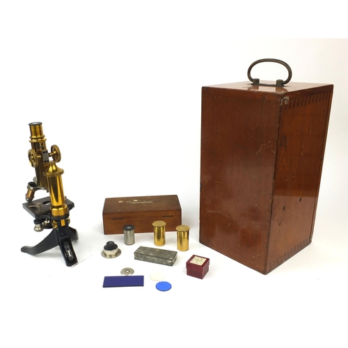 151 - E Leitz Wetzlar microscope together with fitted mahogany carrying case, lenses and an oak case of gl... 