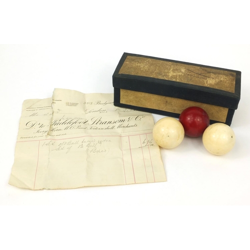 147 - Boxed set of three Victorian ivory billiard balls including a stained red example, together with ori... 