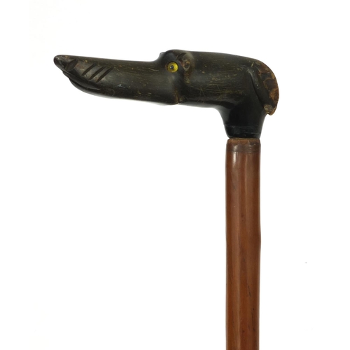 26 - Wooden walking stick with carved horn handle in the form of a dogs head, with beaded glass eyes, 88c... 