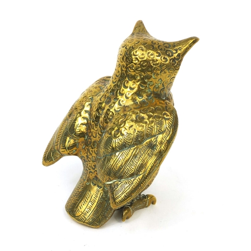 135 - Heavy brass owl paperweight with beaded glass eyes, impressed marks to the underside, 11cm high