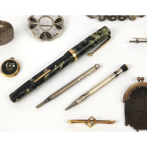 74 - Group of objects including a silver nurses belt buckle, Swan marbleised fountain pen with 14ct gold ... 